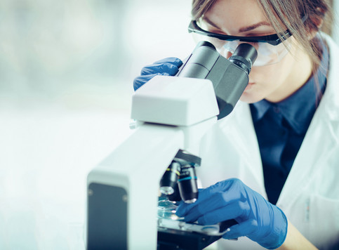 Female scientist microscope